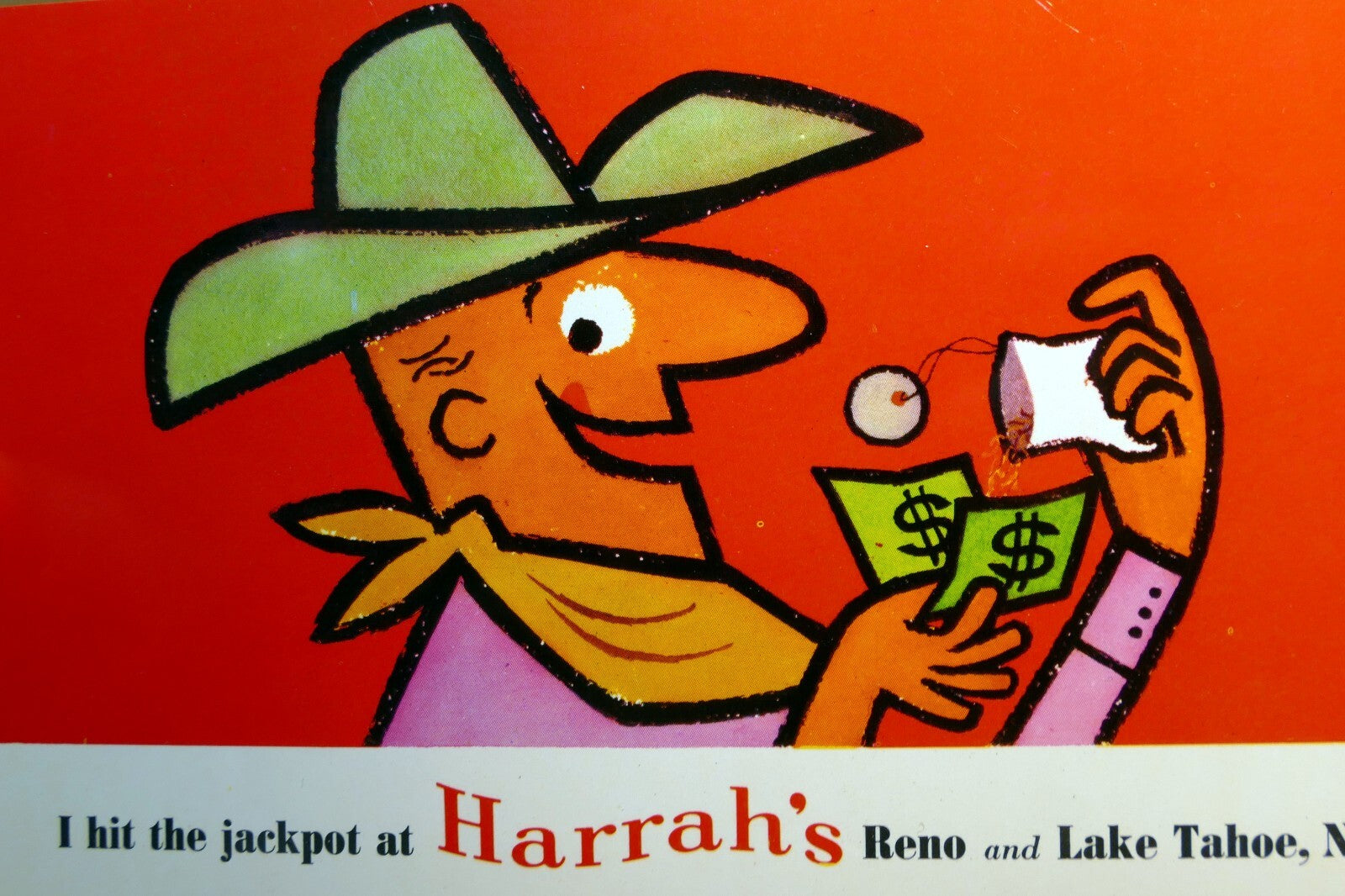 I hit the jackpot at harrah's reno lake tahoe cowboy unused postcard 1960's casino reno