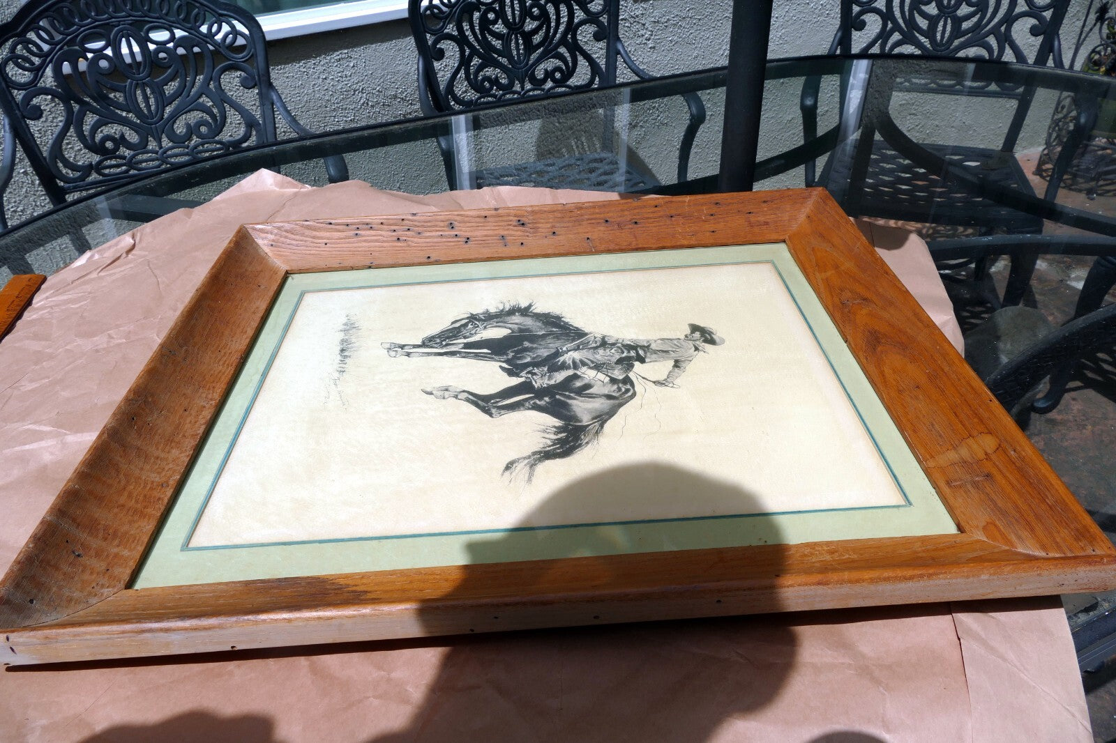 Sunfisher signed Frederic Remington cowboy on a horse framed  13X17"