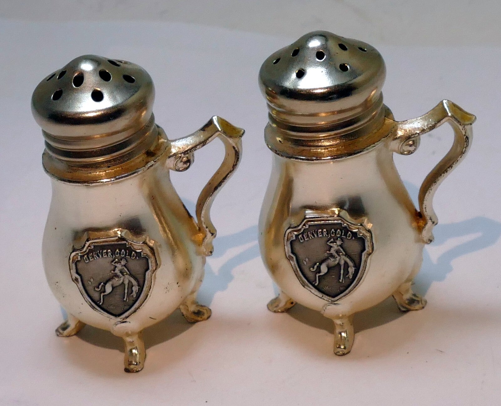 Cast iron salt & pepper shaker souvenir of denver colorado rider & bronco usa