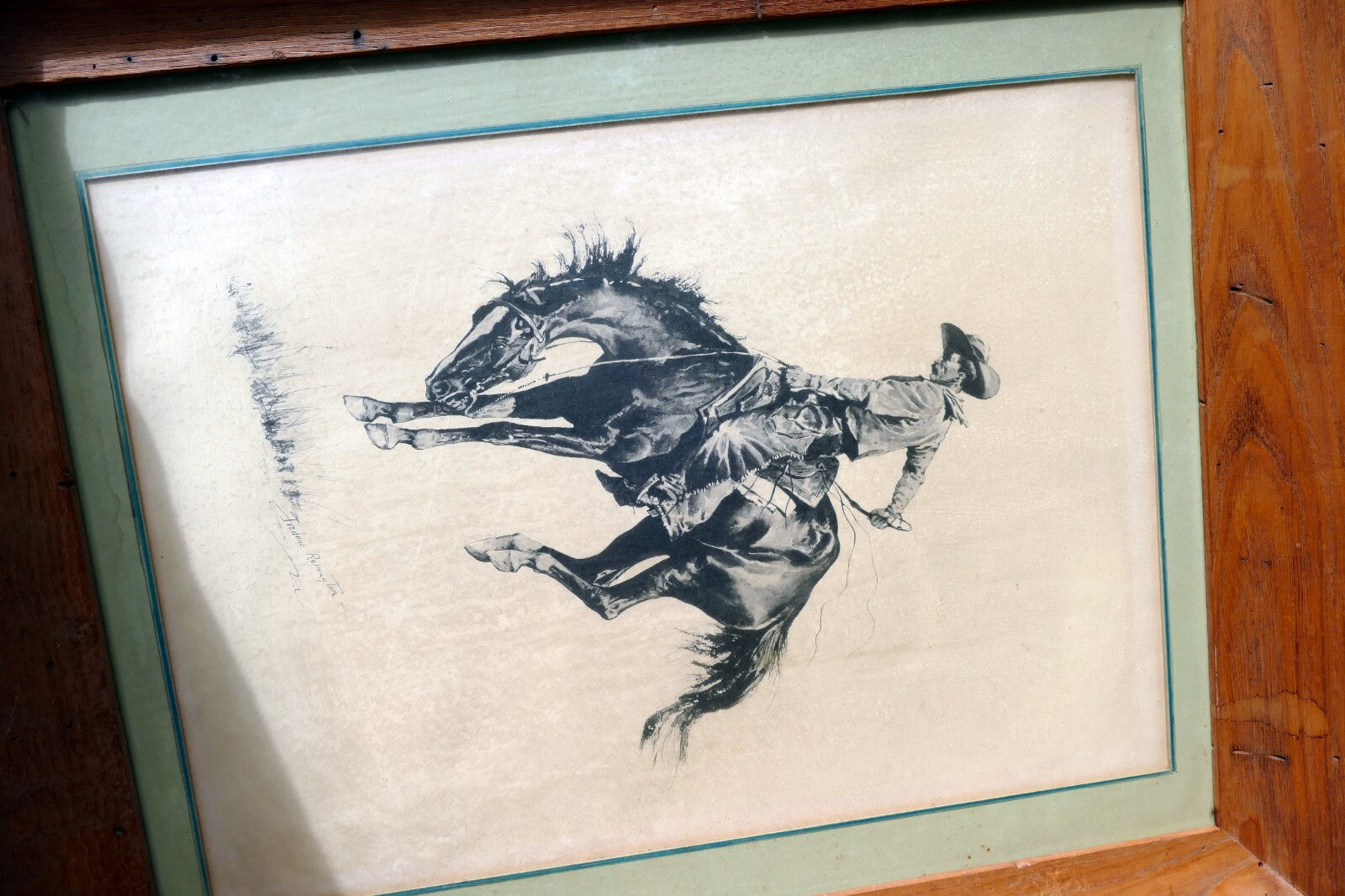 Sunfisher signed Frederic Remington cowboy on a horse framed  13X17"