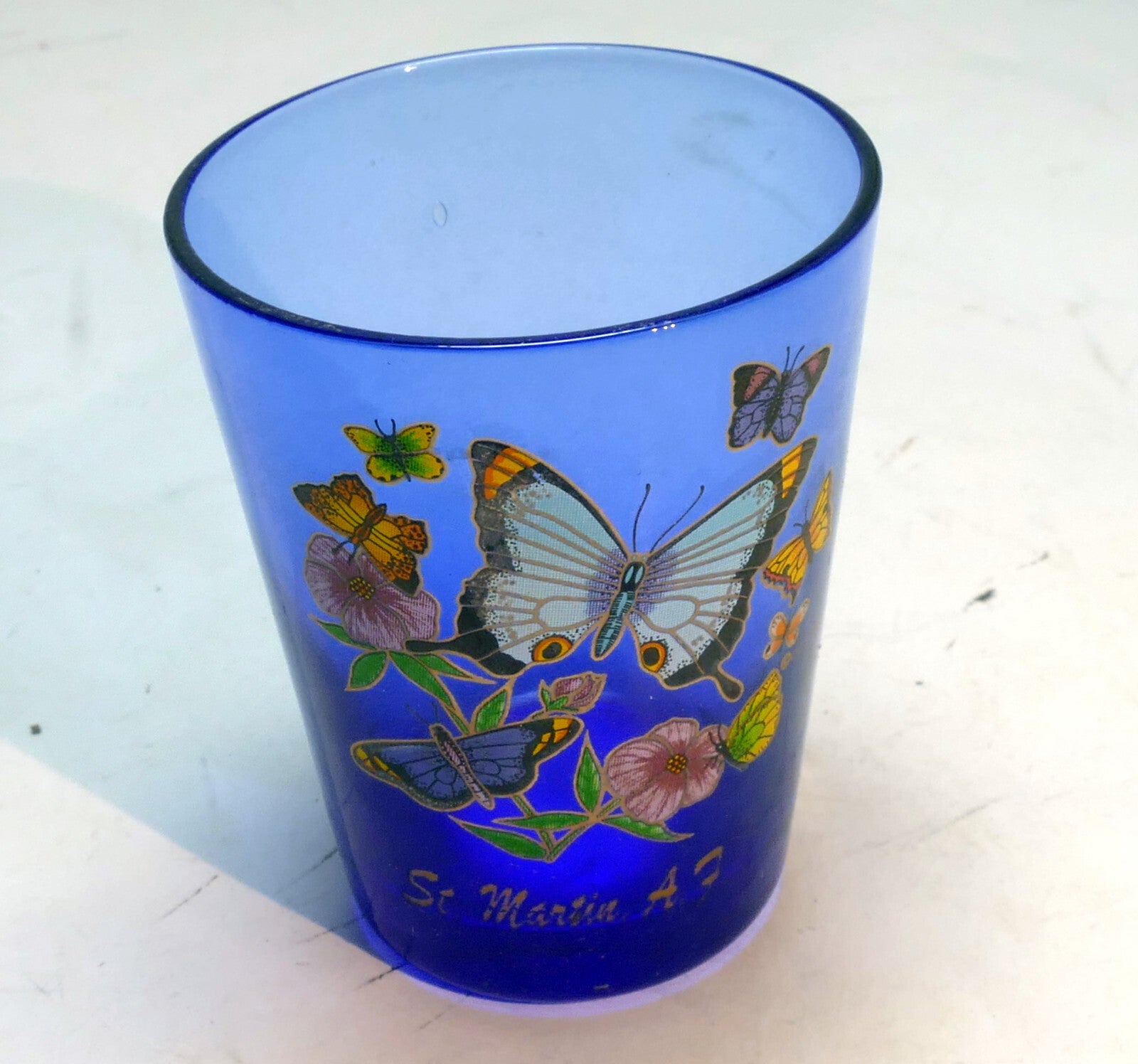 St. martin a.f. shot glass 2 oz with butterflies blue glass