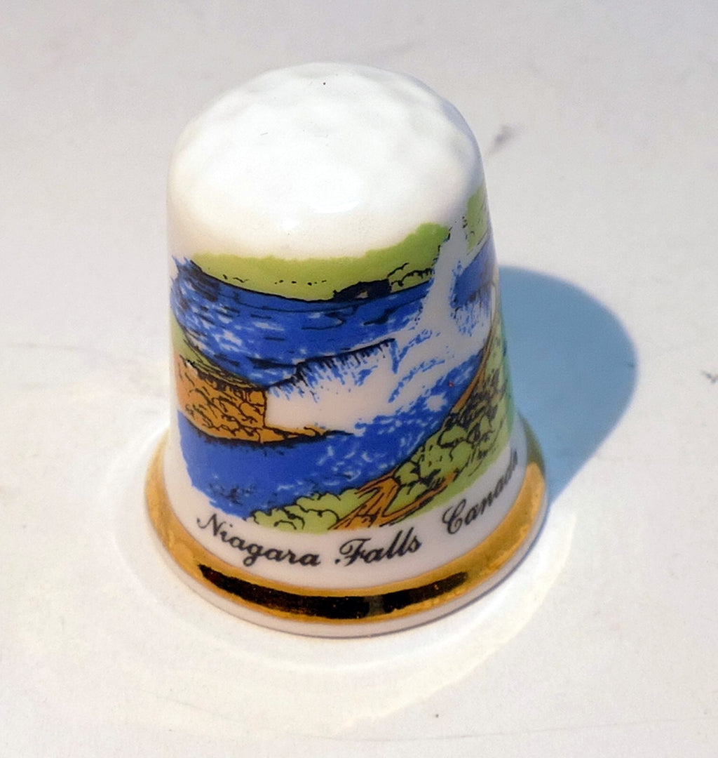 Porcelain thimble souvenir niagara falls canada waterfall river