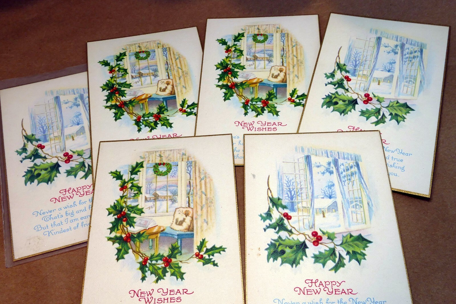 Unposted postcard lot from 1950's happy new year snow scene window