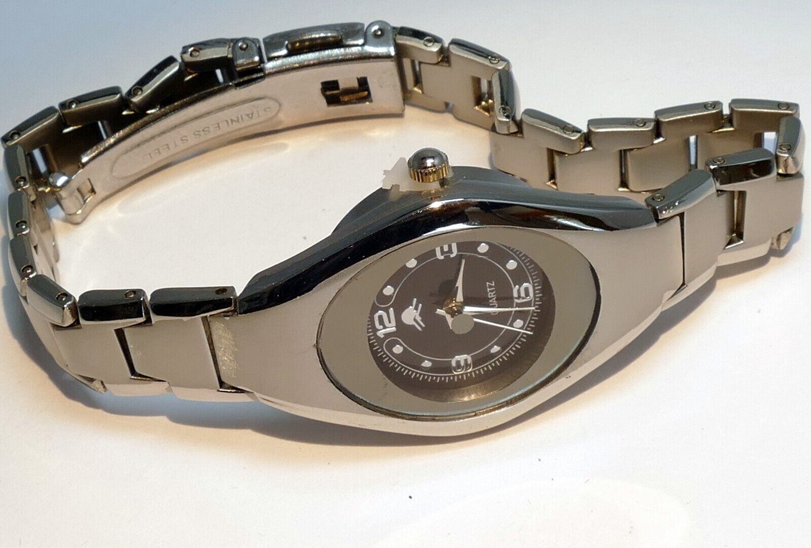 Ladies black/silver tone quartz arabic numerals watch   needs battery