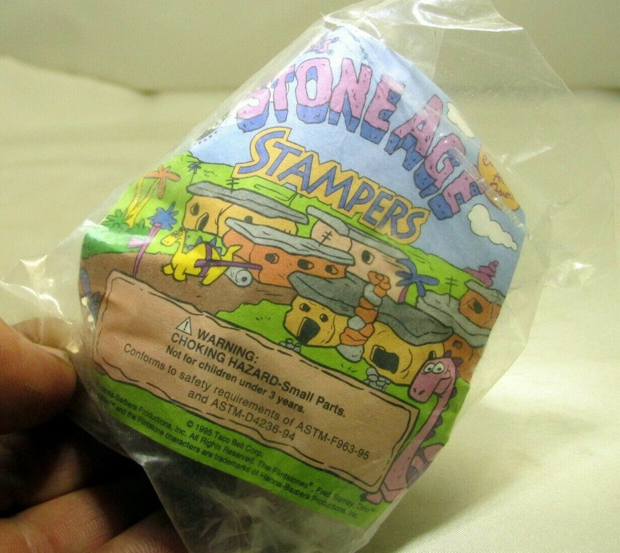 1995 taco bell 1995 flintstones stone age stampers