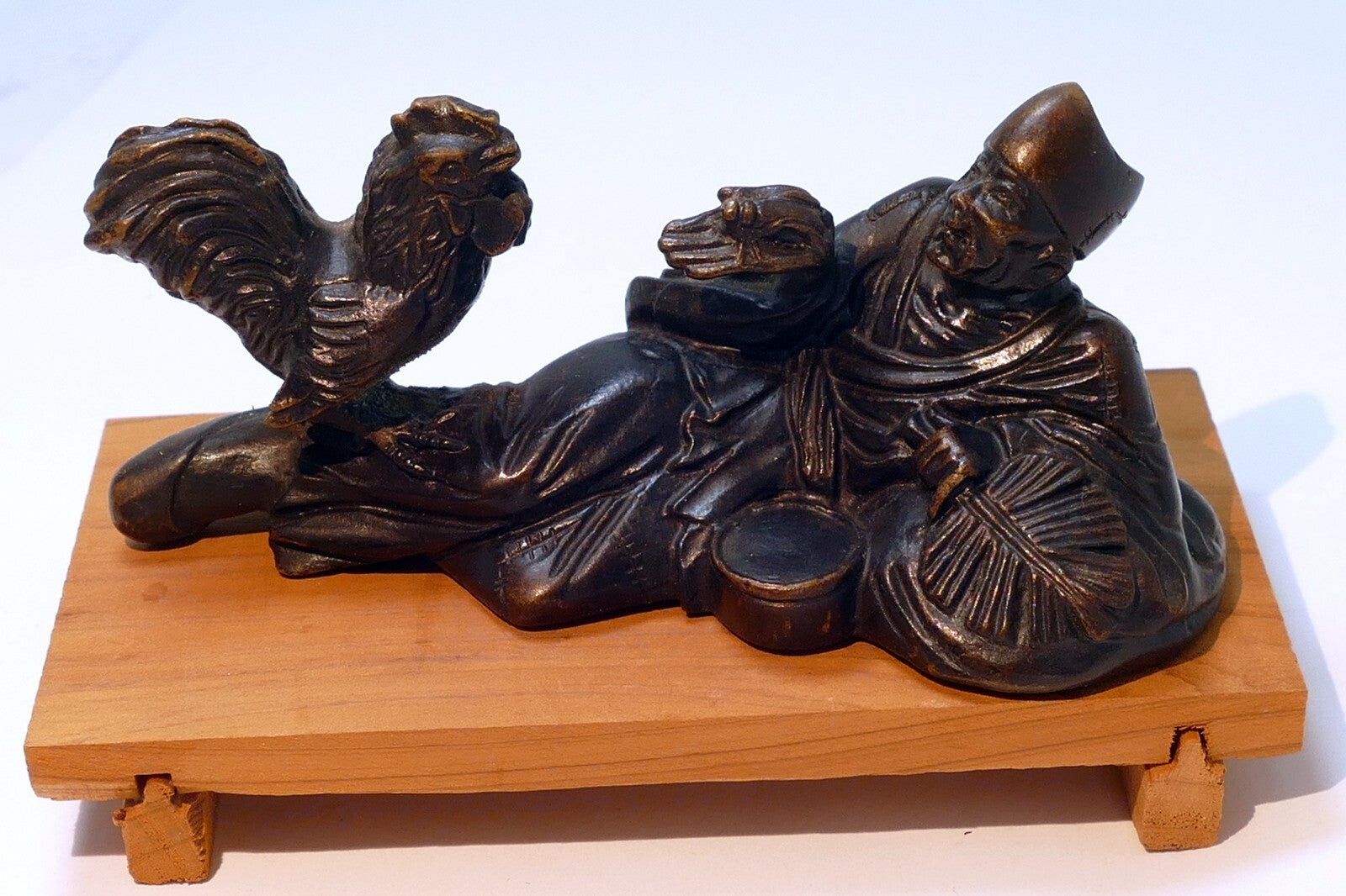 Chinese bronze statue reclining individual w/ rooster scroll weight ming period