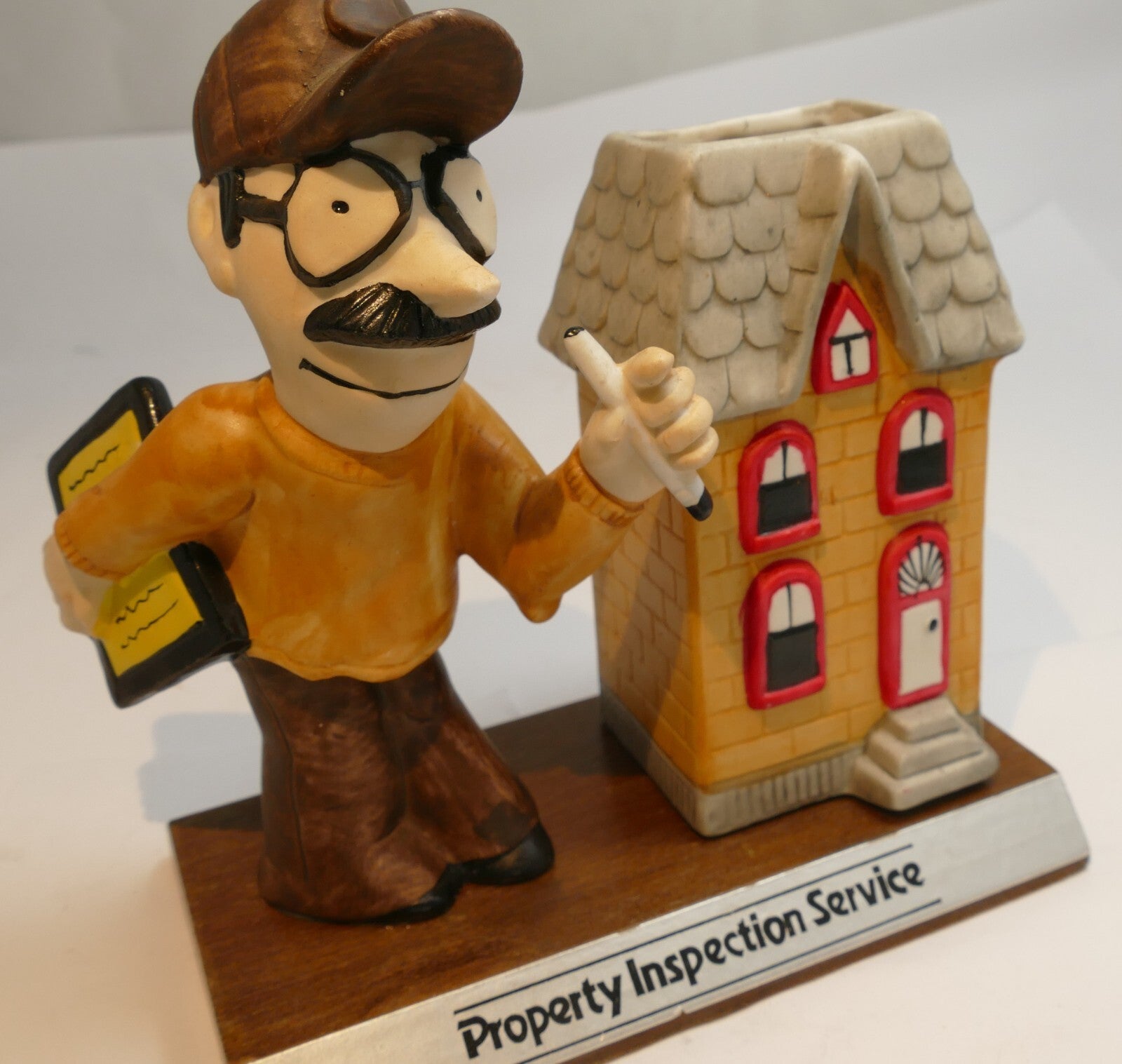Property inspection service add figurine advertisement desktop pencil holder